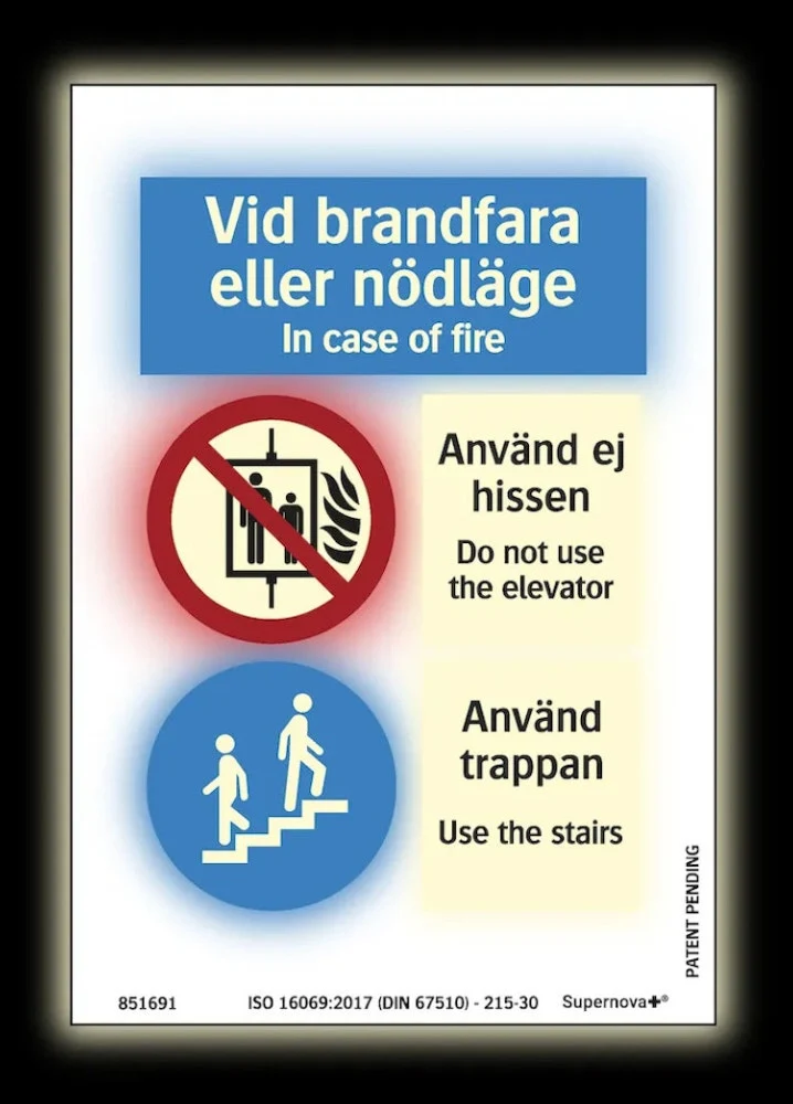 Färgefterlysande Brandskylt "Hisskylt vid brandfara eller nödlägen" - Supernova®