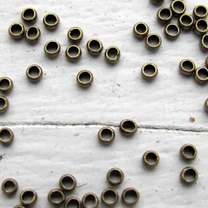 Klämpärlor - Bronsfärgade 2 mm (50-pack)