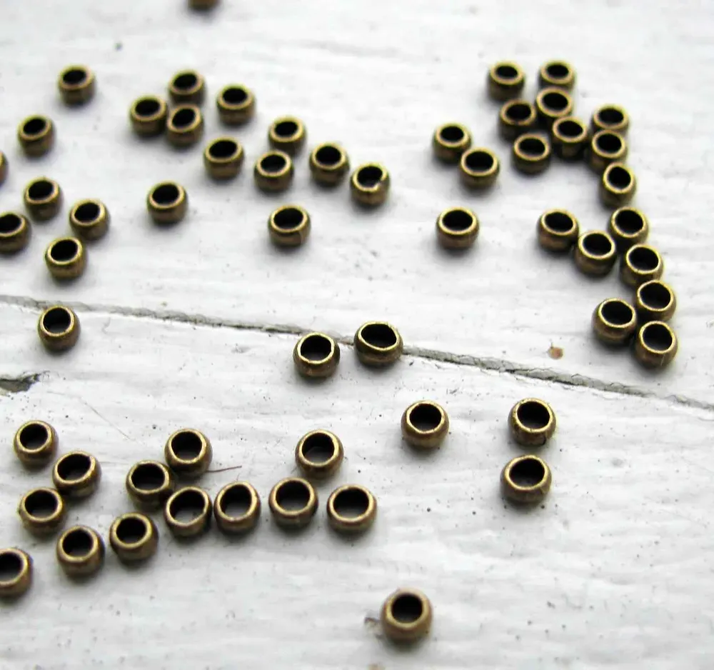 Klämpärlor - Bronsfärgade 2 mm (50-pack)