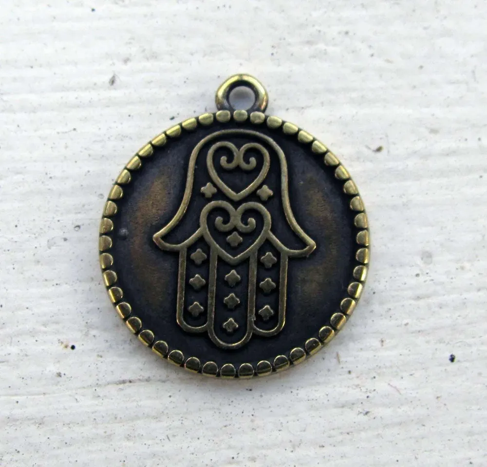 Berlock bronsfärgad - Rund med hamsa 20mm 1 styck