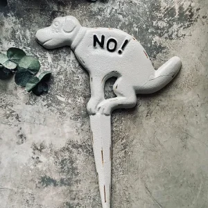 Skylt i gjutjärn - pooing "No!"
